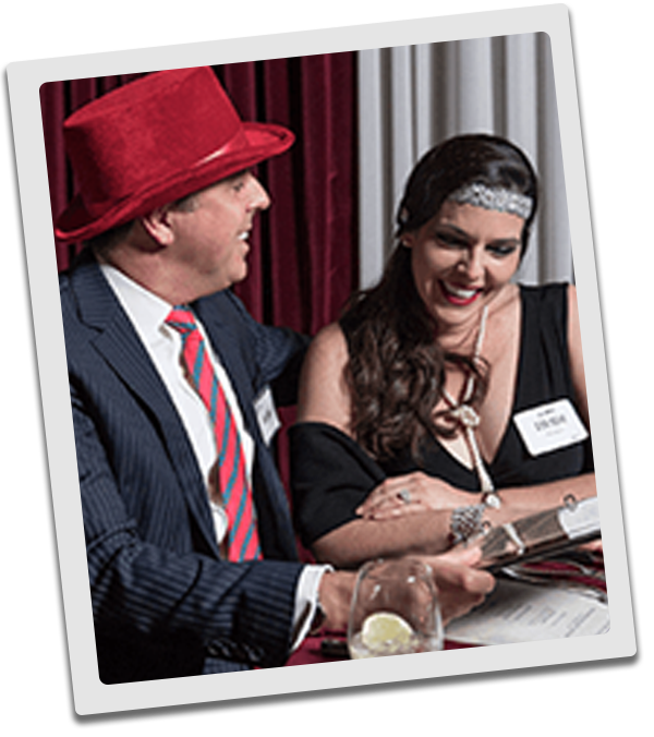 Philadelphia Murder Mystery couple checking out the dinner menu